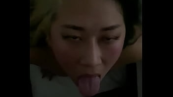 Asian whore Hana Bangz sucks another man's cock for a big facial